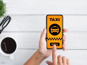 Woman using taxi booking app on smartphone